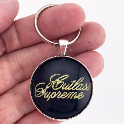 Vintage Oldsmobile Gold Cutlass Supreme 1973-1977 Emblem 1.2" Diameter Keychain