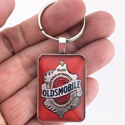 Antique Oldsmobile Emblem (1897-1919) 1" x 1.25" Diameter Keychain