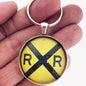 Vintage Distressed Railroad Crossing Sign 1.2" Diameter Keychain