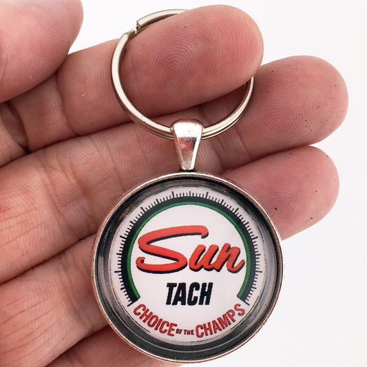 Vintage Sun Tach Choice of Champs Ad 1.2" Diameter Keychain